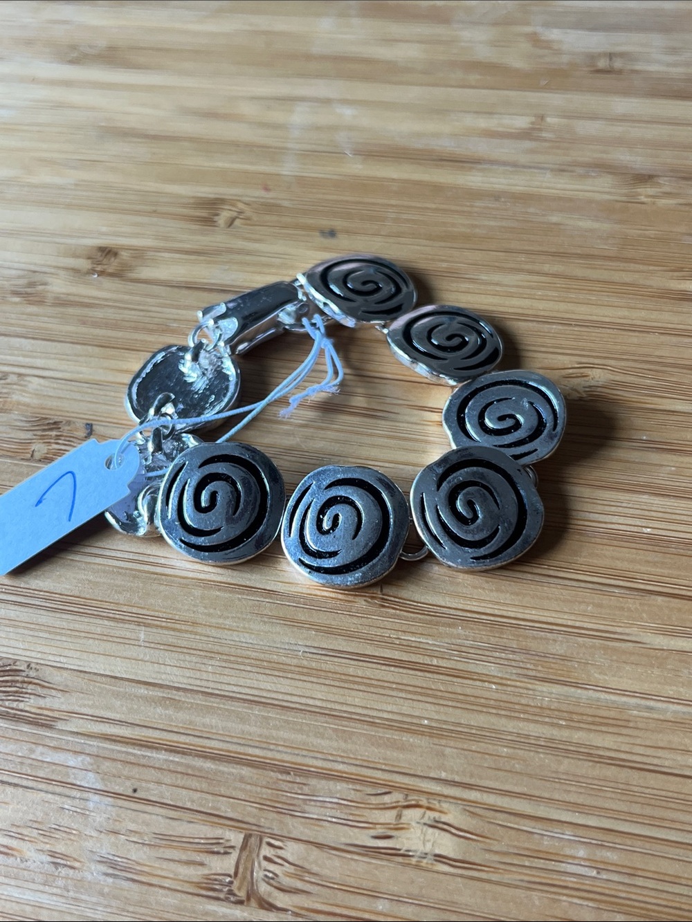 7 Silver Tone Swirl Discs Magnet Closure Bracelet